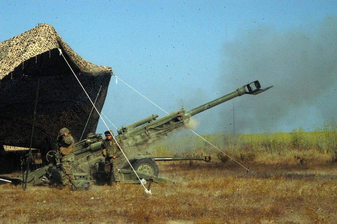 M777 155mm howitzer firing during a Field Artillery live-fire exercise.